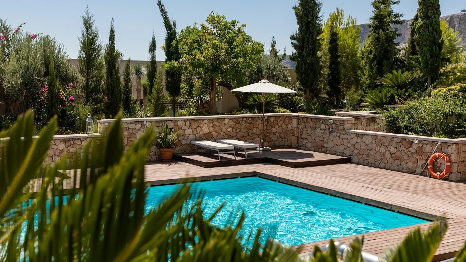 Aluminium garden sofa and dining furniture on a paved UK patio