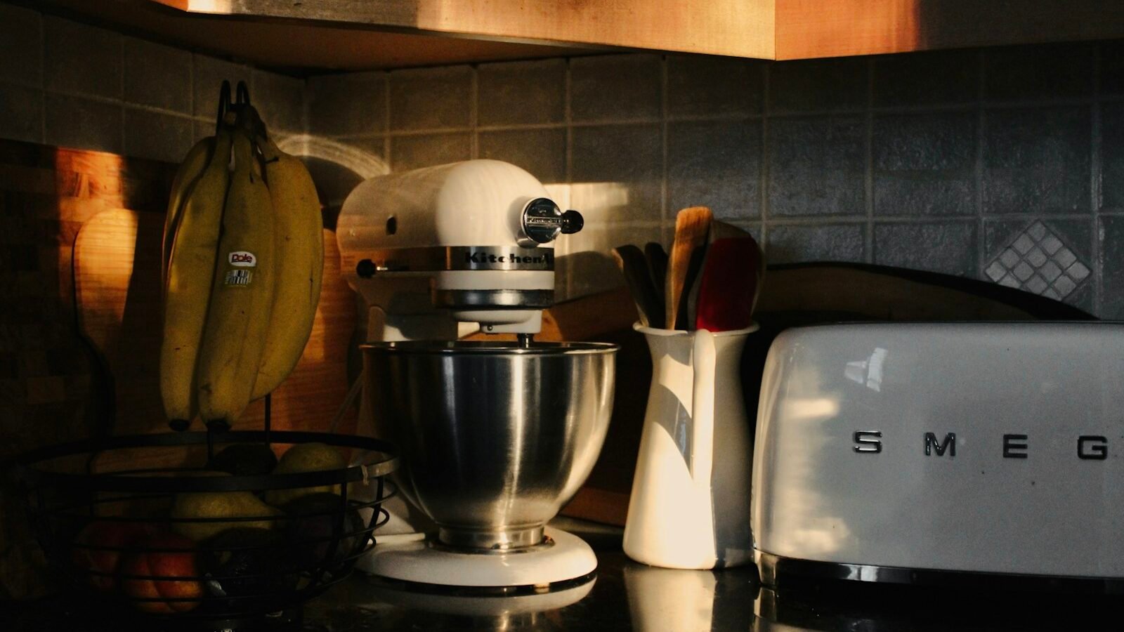 Small countertop oven on a kitchen worktop beside other appliances