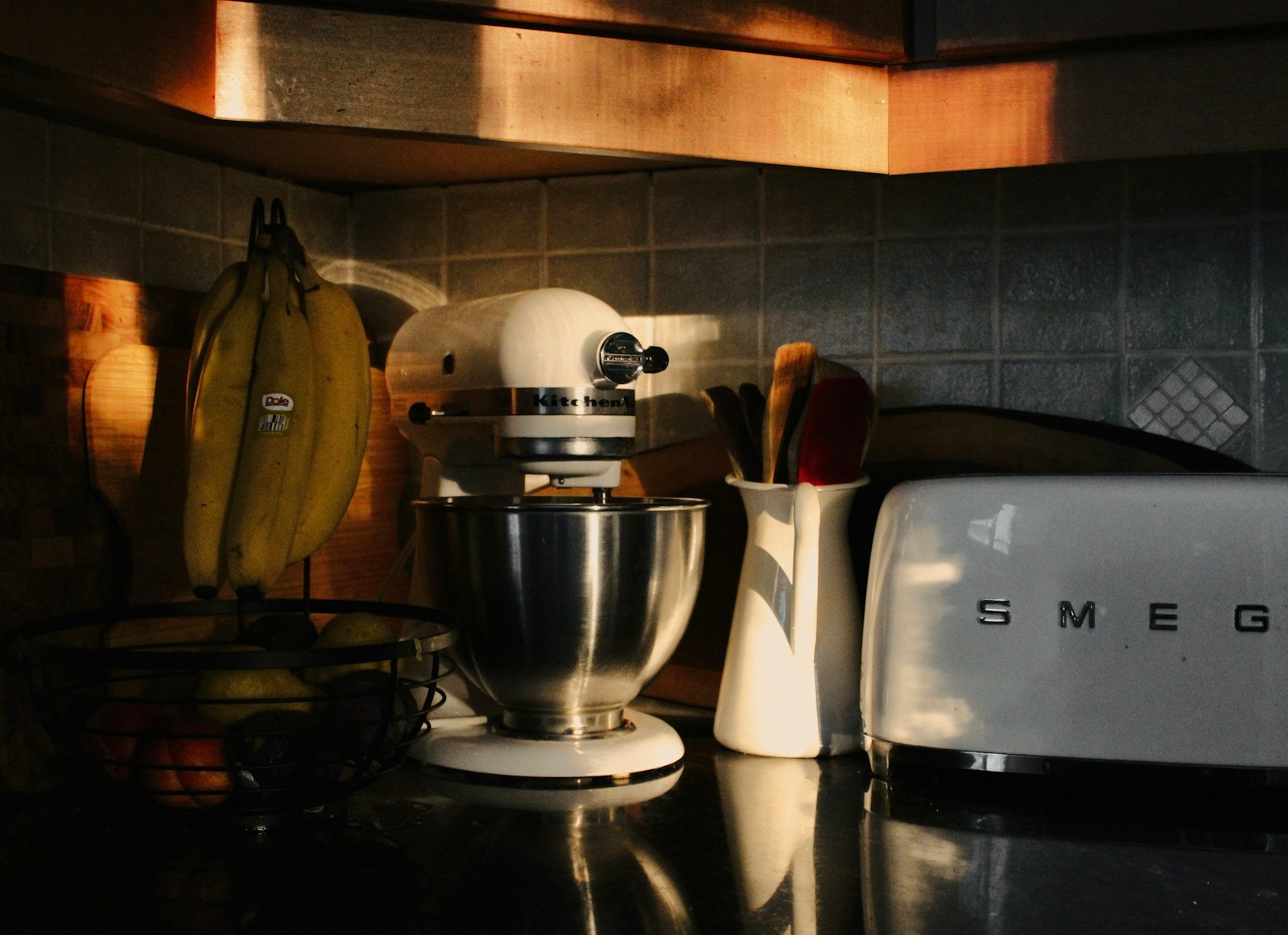Small countertop oven on a kitchen worktop beside other appliances