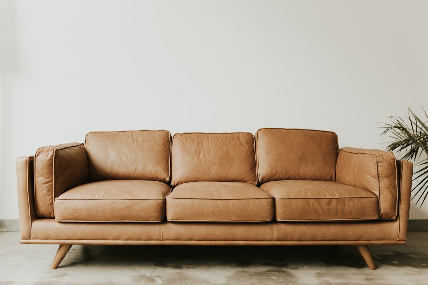 living room armchair beside a side table and floor lamp