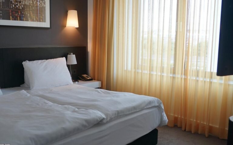 beige bedroom decor arranged in a practical UK setting