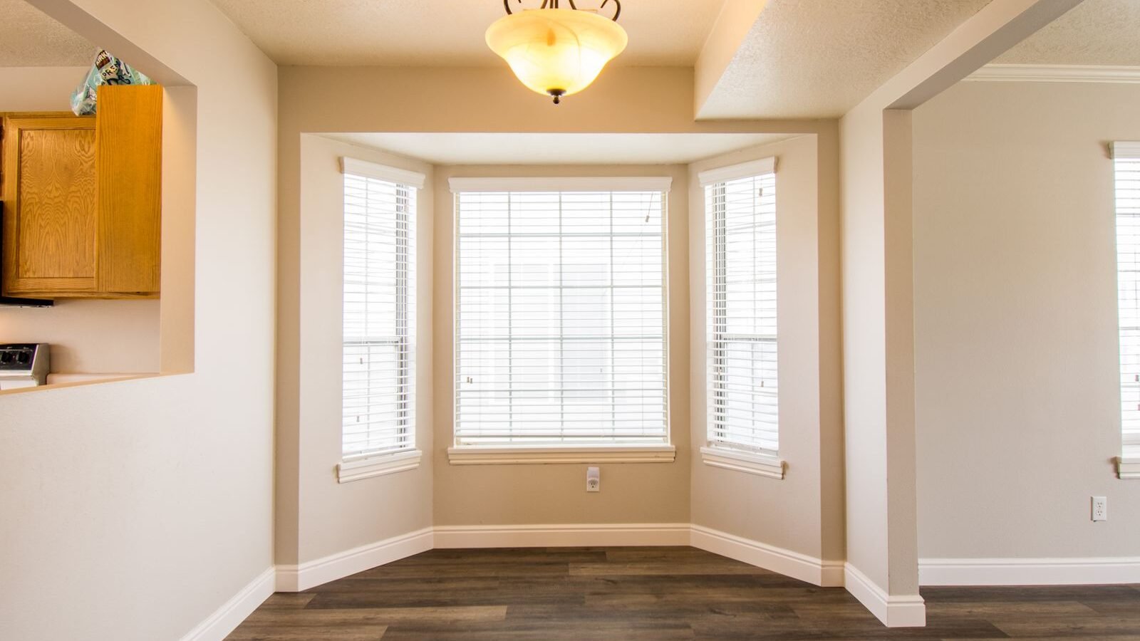 Bright room with large bay windows and natural light