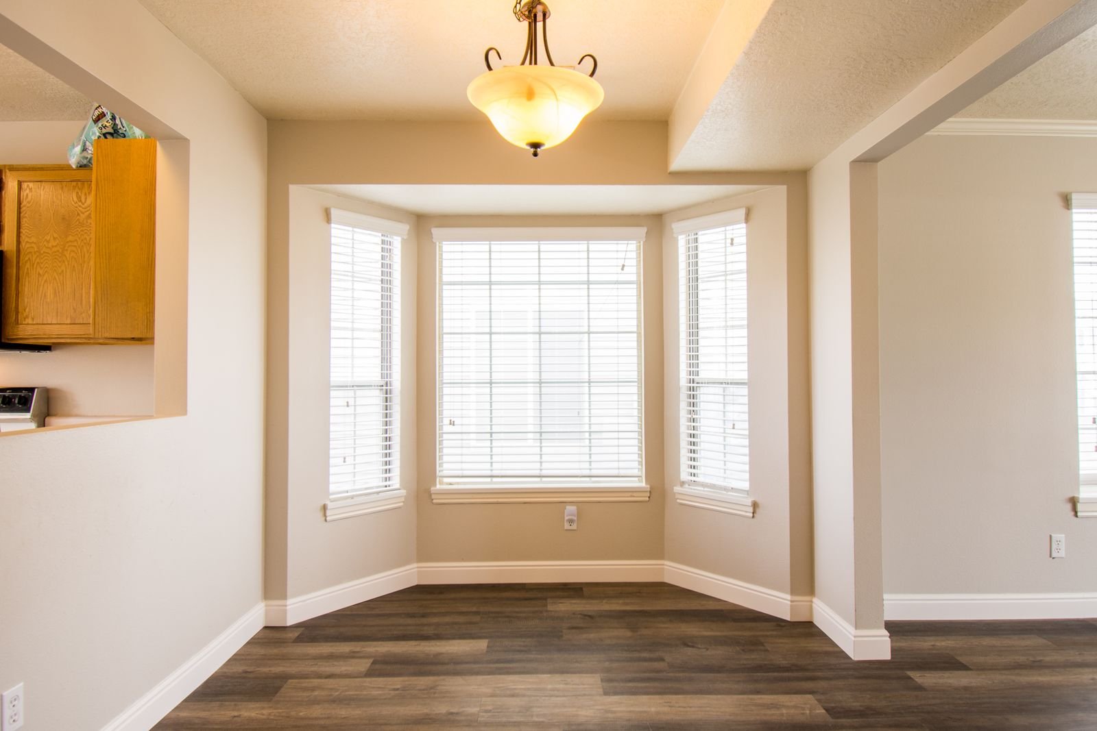 Bright room with large bay windows and natural light