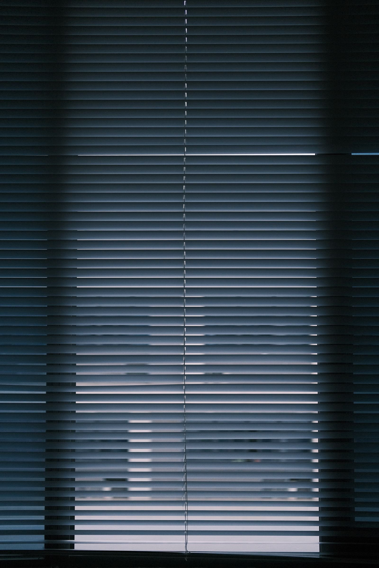 Closed window blinds shown in a modern interior