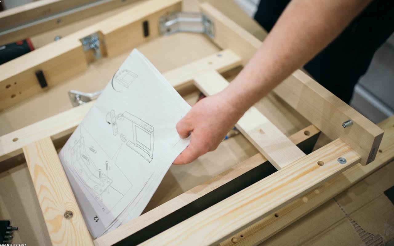 Home improver reviewing renovation plans in a UK terraced house