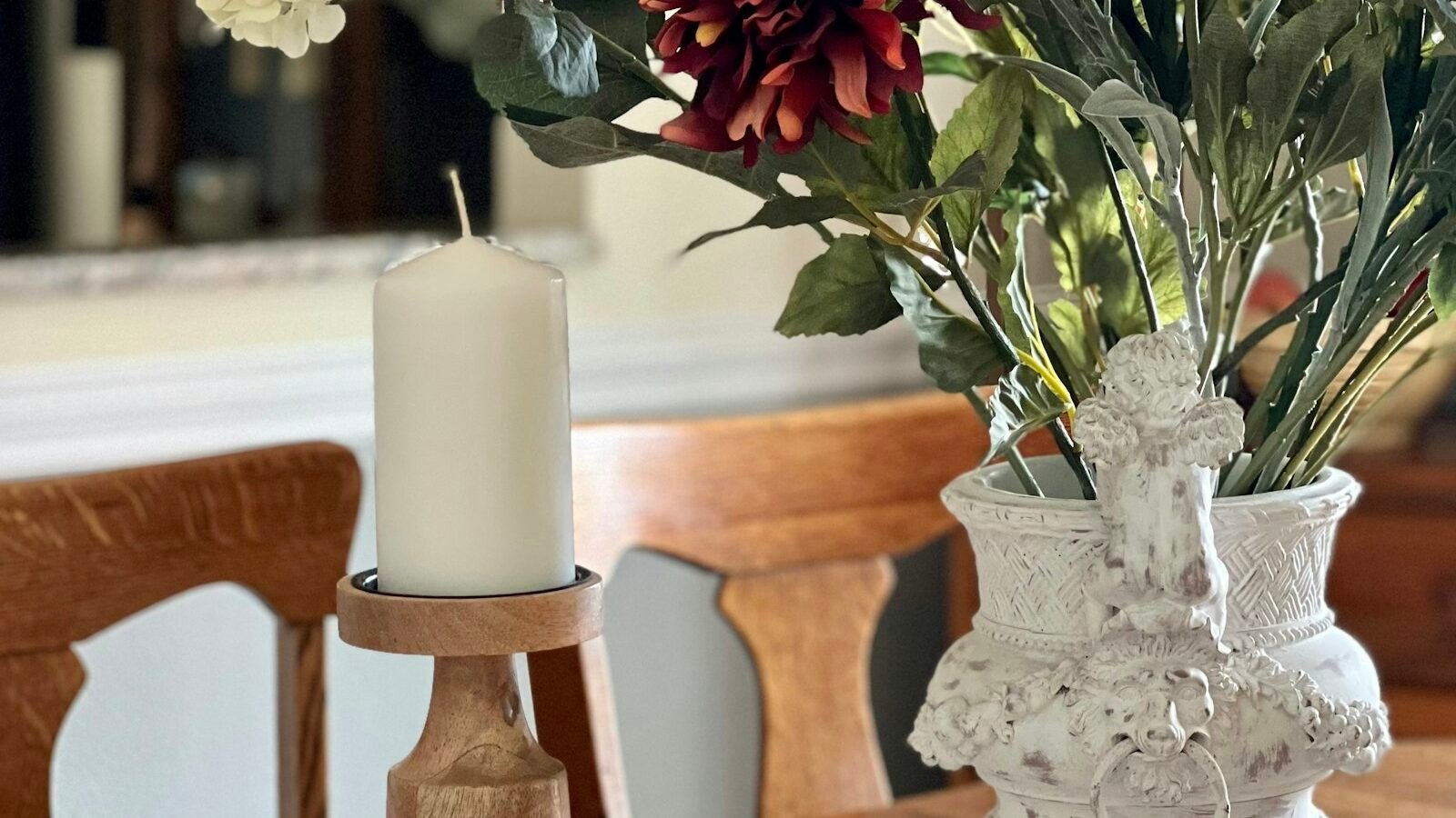 Solid oak dining table with vase and candle in a UK home interior