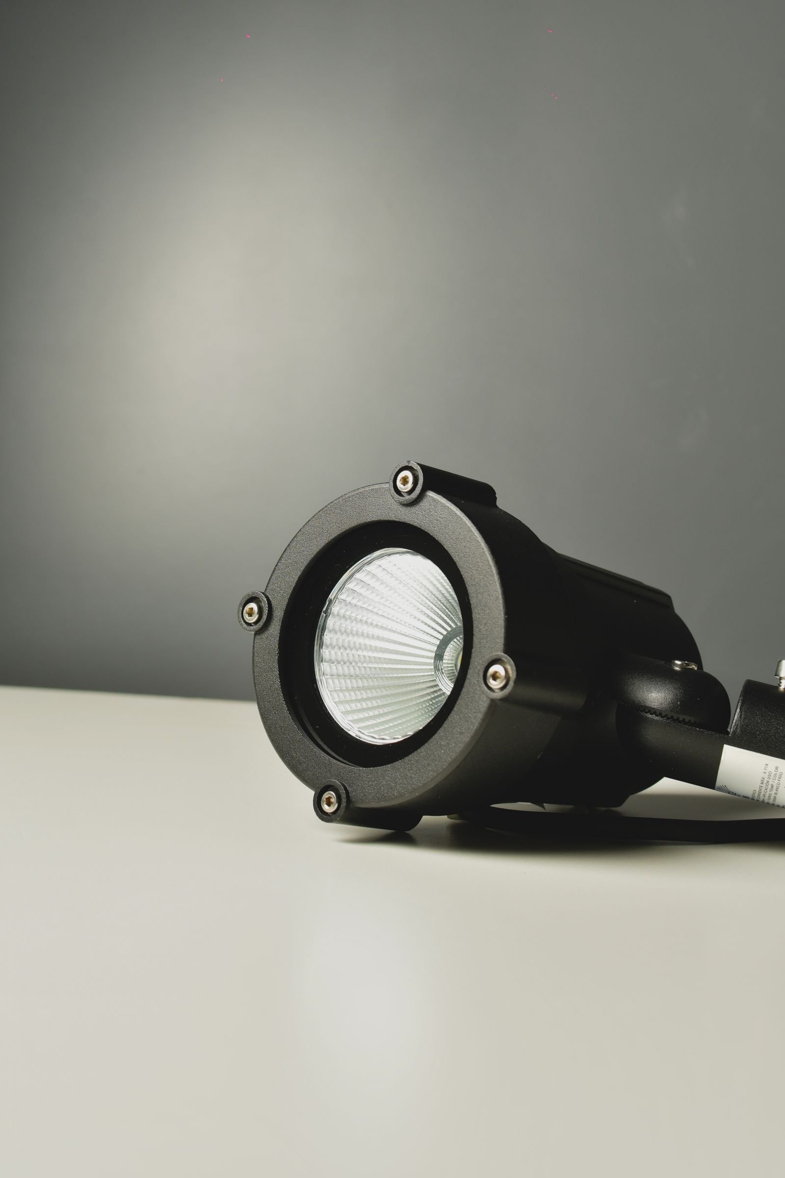 Black spotlight fitting ready for a garden lighting scheme