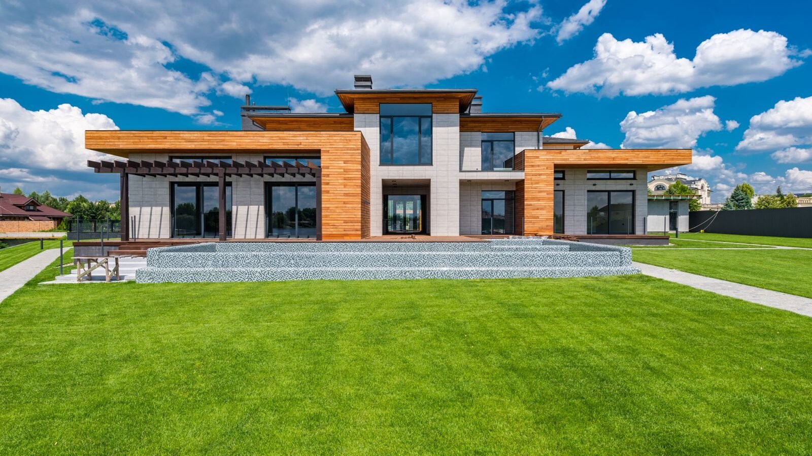 Contemporary new-build home with a simple lawn and garden