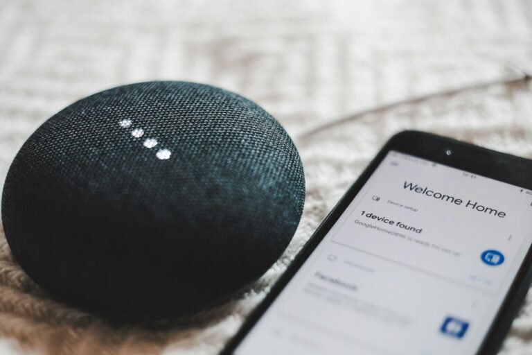 Smart speaker and phone showing a connected smart home setup