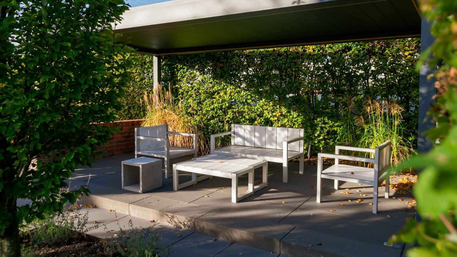 Outdoor garden dining furniture with chairs and table on a patio