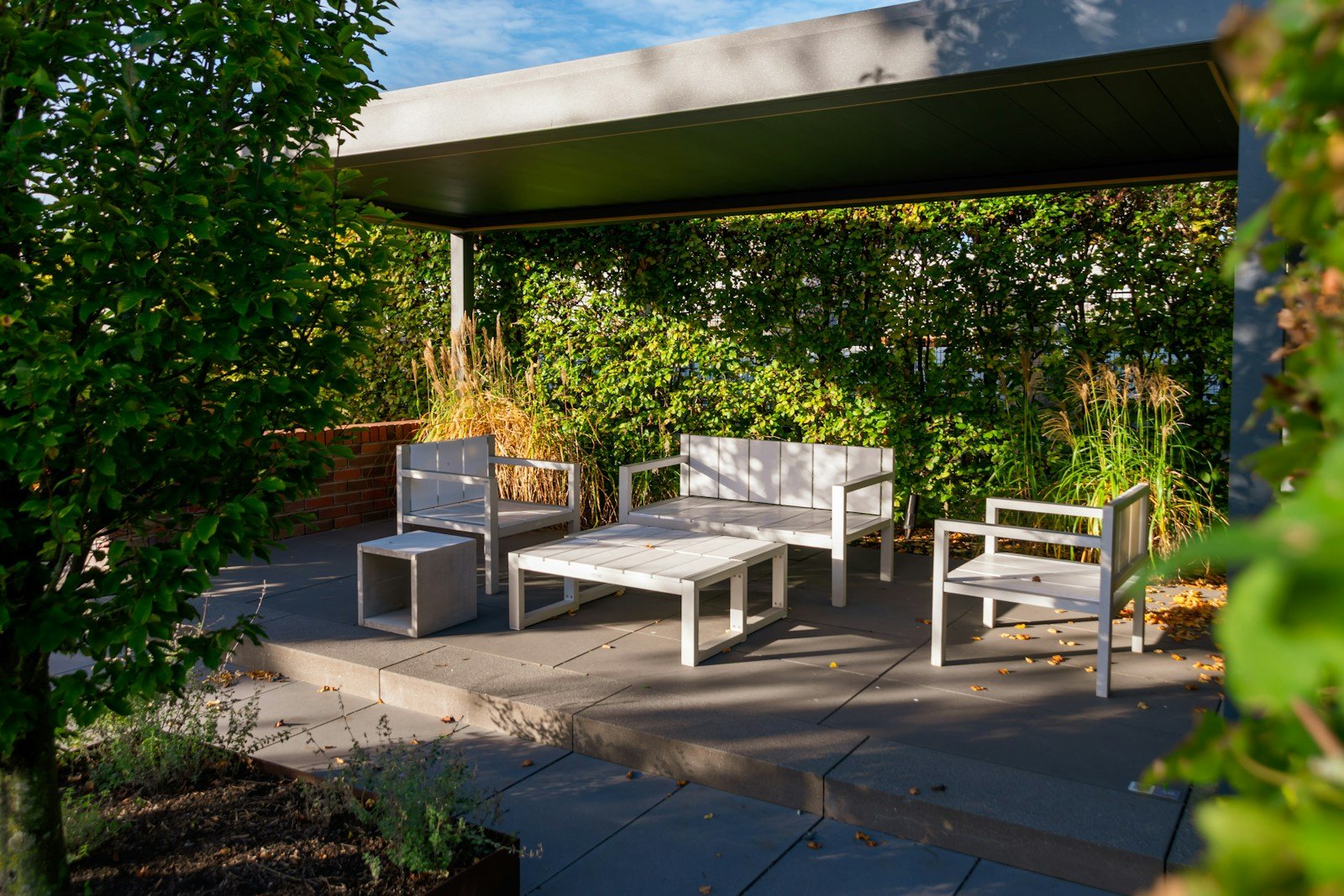 Outdoor garden dining furniture with chairs and table on a patio