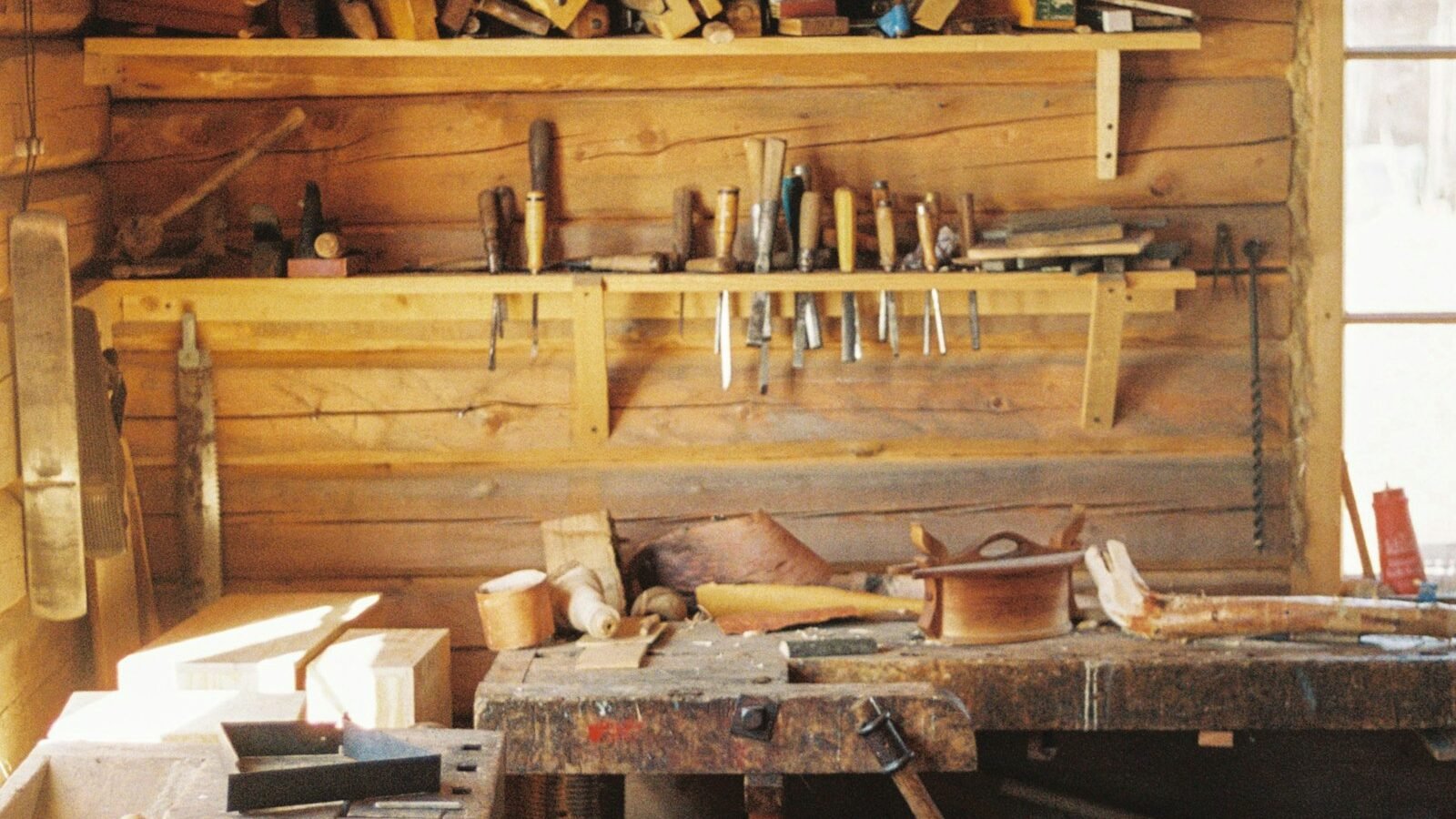 Woodworking workbench with hand tools arranged for a project