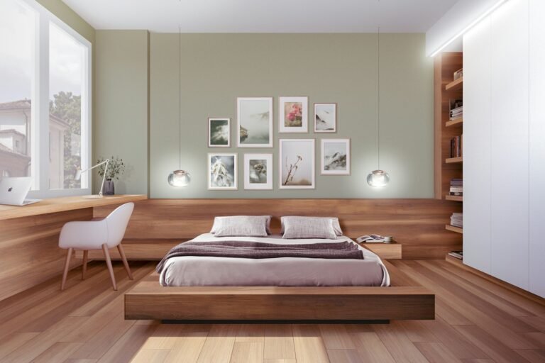 Made bed beside a bright bedroom window