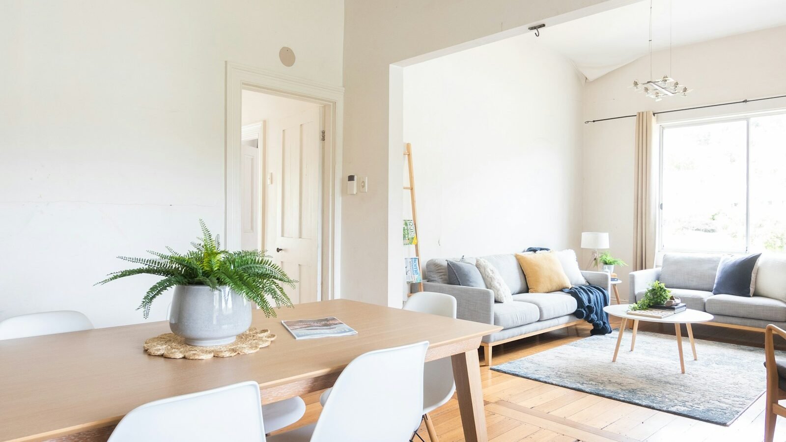 Rectangular dining table and chairs in a bright dining room