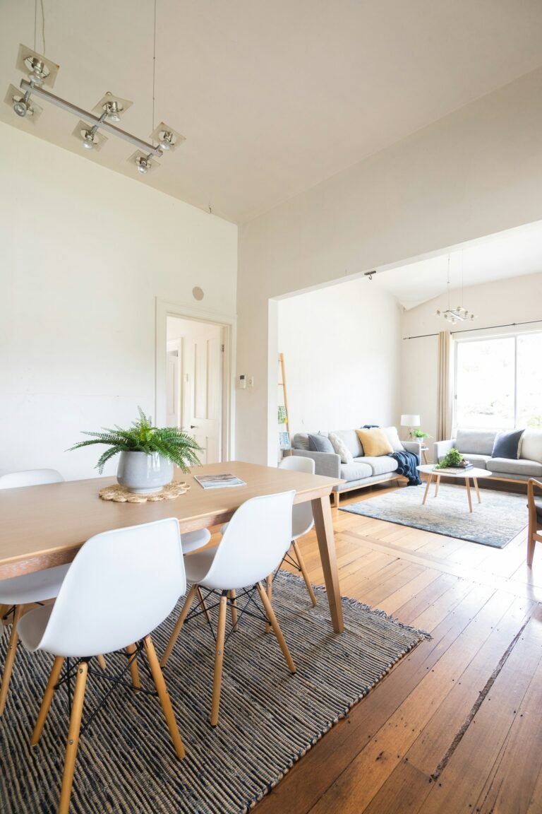 Rectangular dining table and chairs in a bright dining room