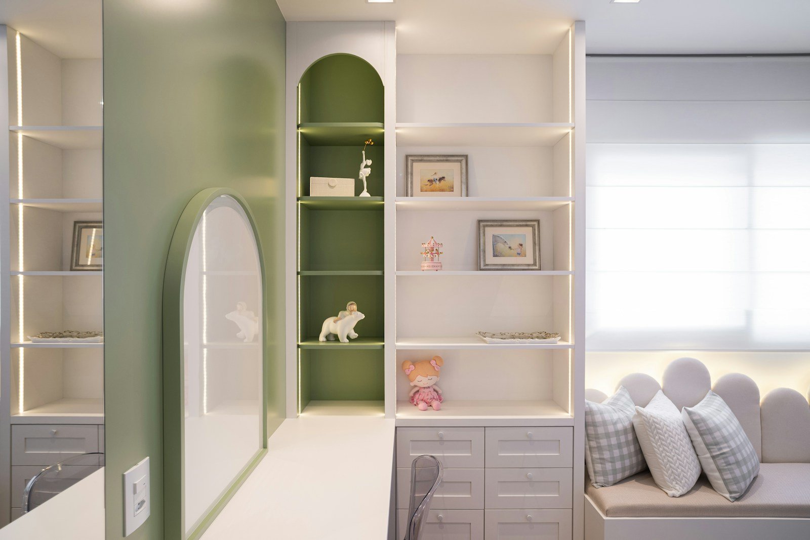 Built-in shelves displaying books and storage items in a living room