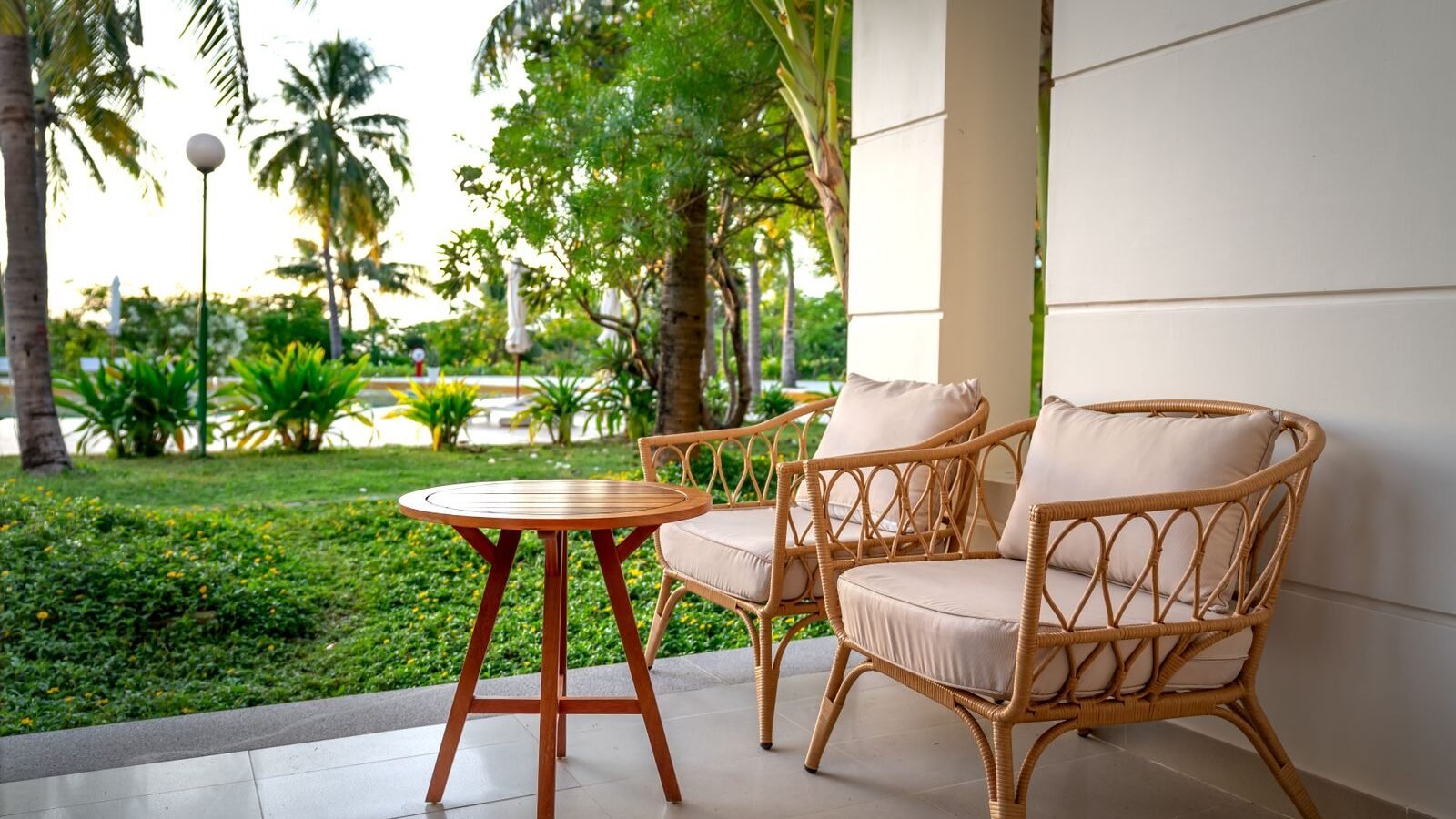 Rattan chairs on a patio illustrating cover fit and weather protection