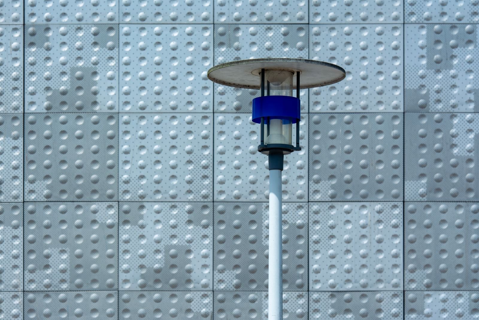 Modern solar lamp mounted against an exterior wall