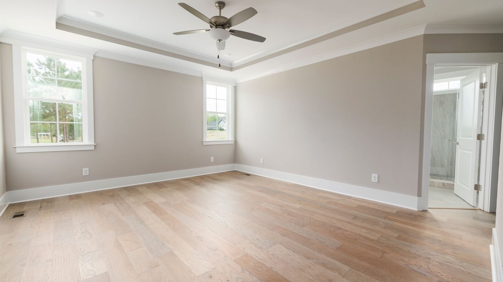 Bright bedroom interior with traditional skirting board detail