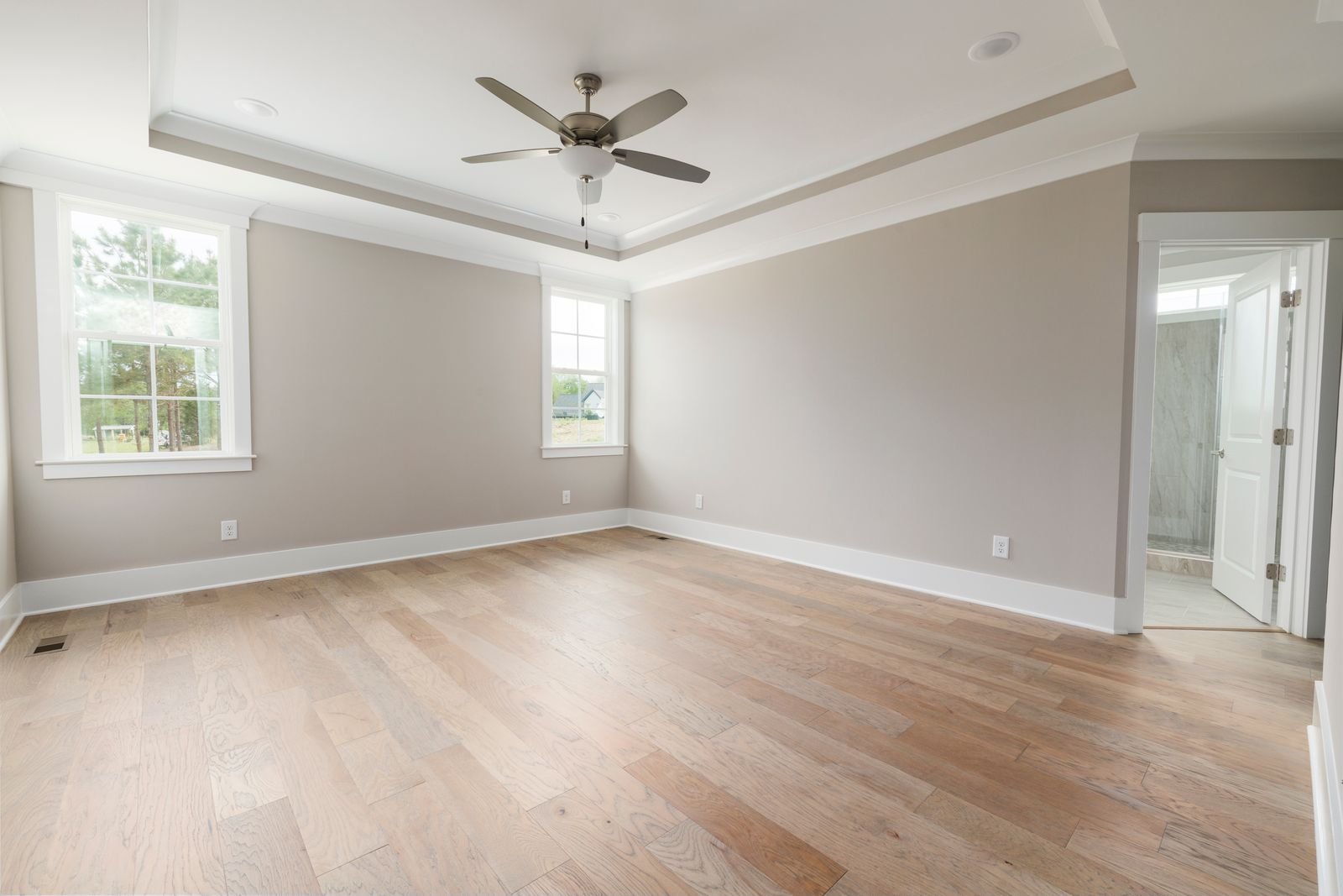 Bright bedroom interior with traditional skirting board detail