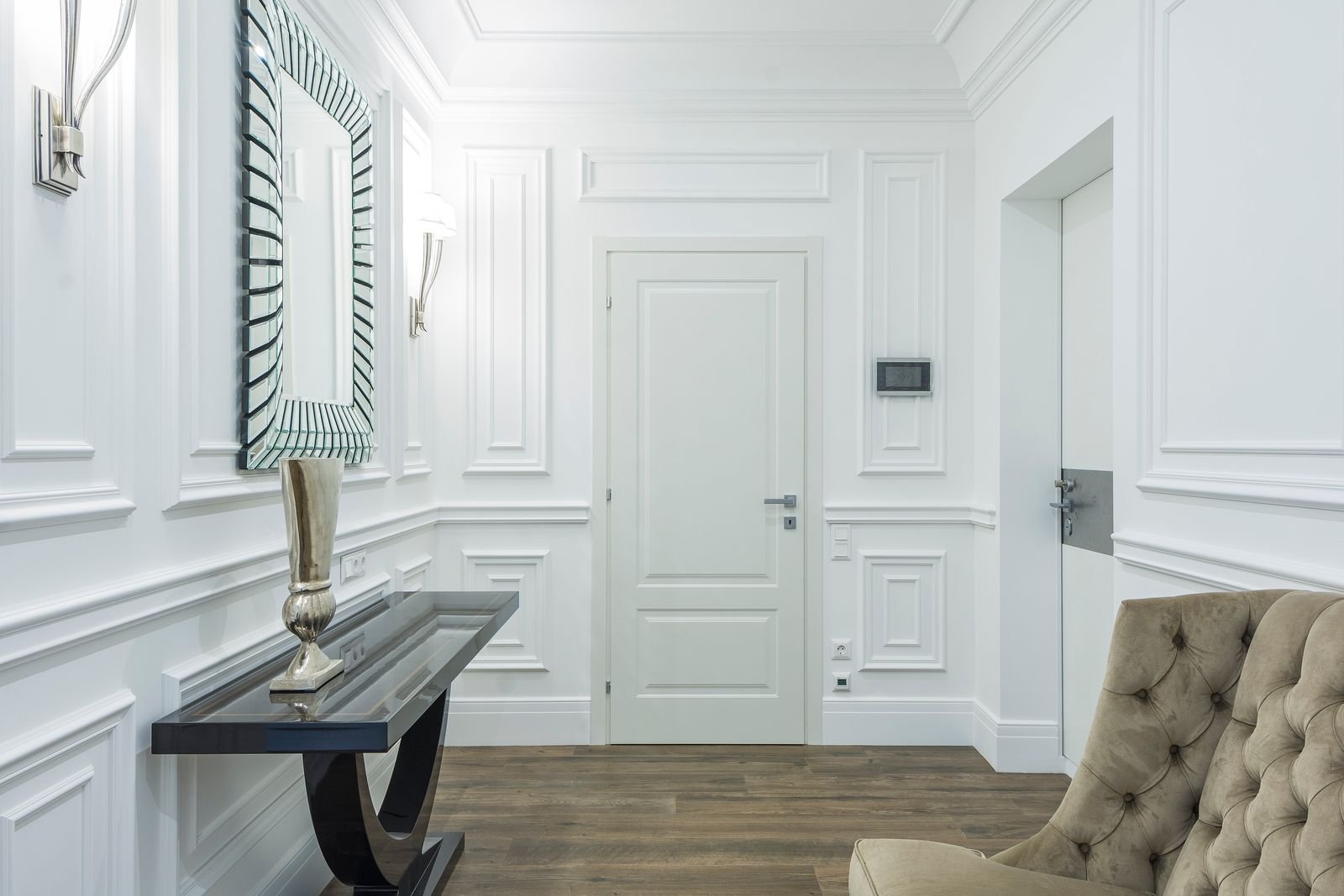 White skirting board framing a bright room with a wood floor