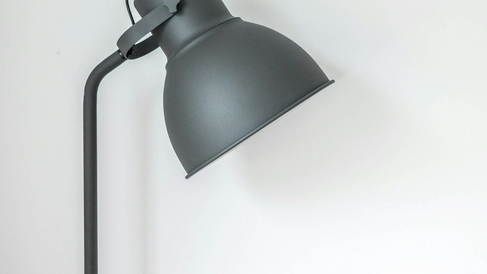 rechargeable light bulb glowing in a table lamp