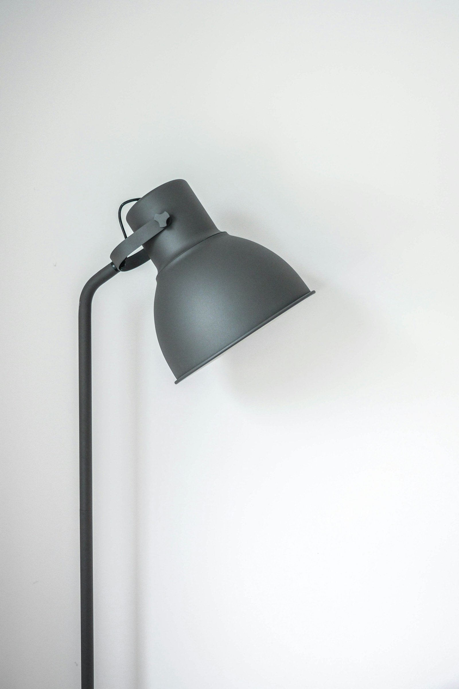 rechargeable light bulb glowing in a table lamp