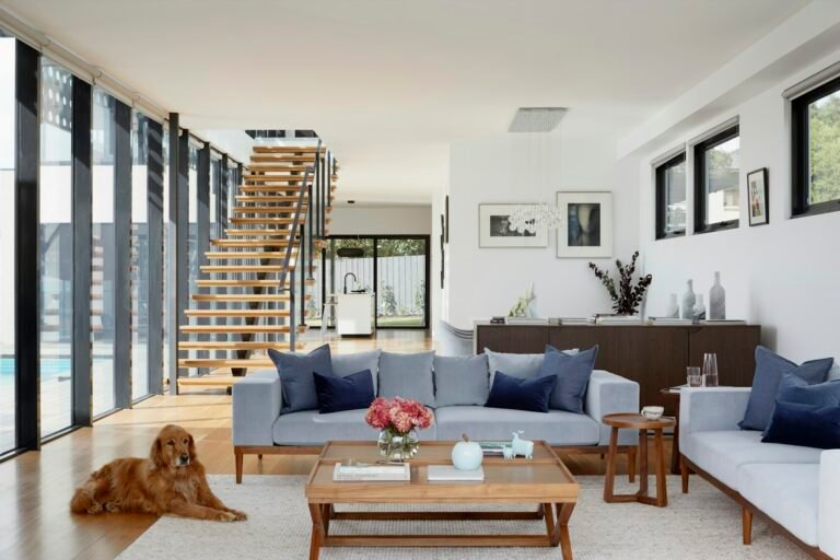 compact living room with a carefully scaled sofa and layered lighting