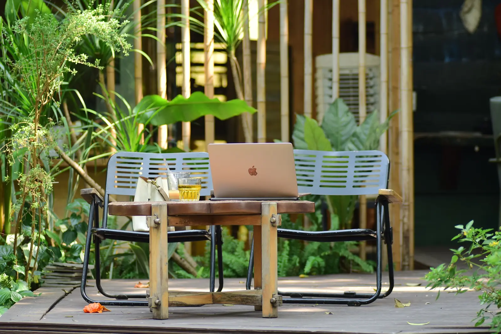 Small desk and chair in a light garden-room setting
