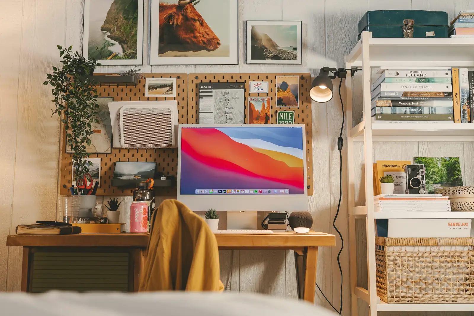 Desk with laptop and storage arranged against a wall