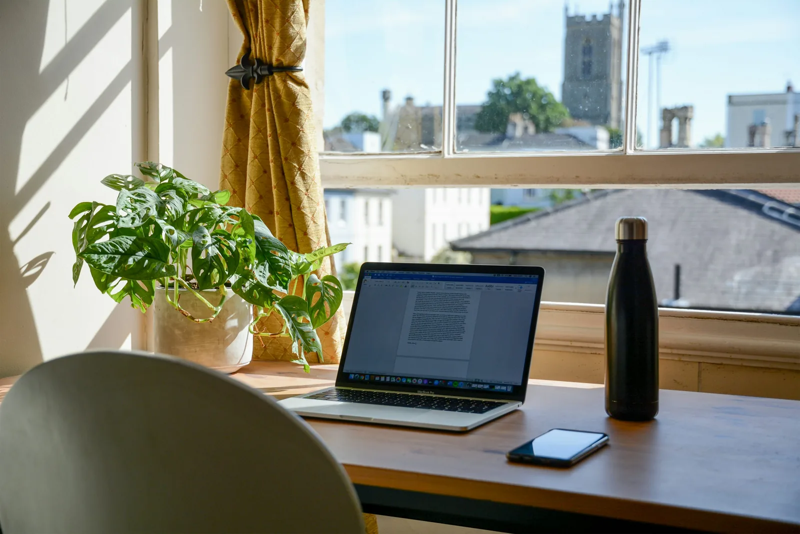 Compact home office with desk, shelves and organised storage