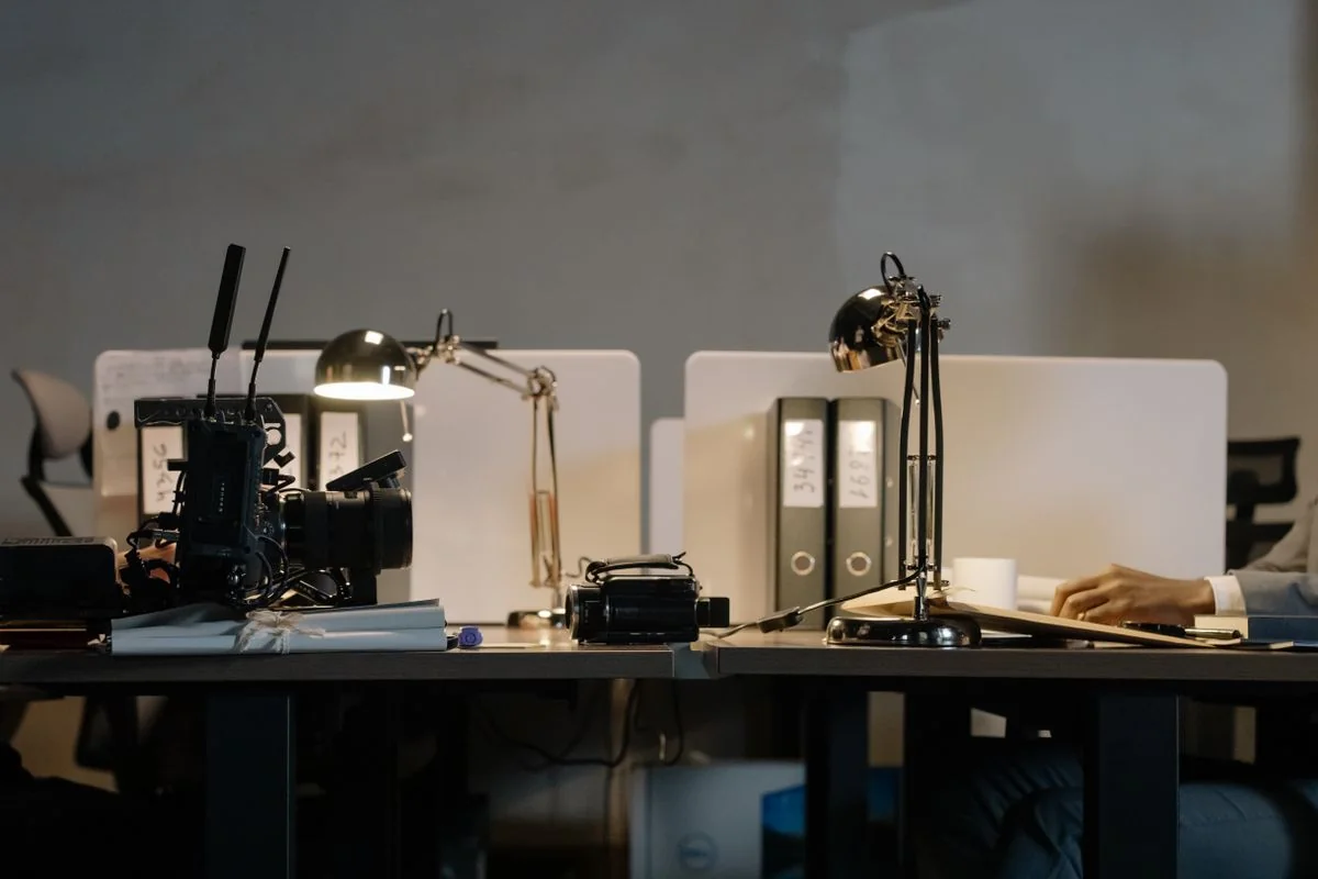 Office desks arranged with individual task lamps